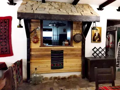 a kitchen in a house with a stove in a room at ХАН КОСТИНА - HAN KOSTINA in Ribarica