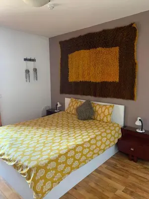 a bedroom with a bed and a painting on the wall at Bansko ski apartment Mountain View Resort in Bansko