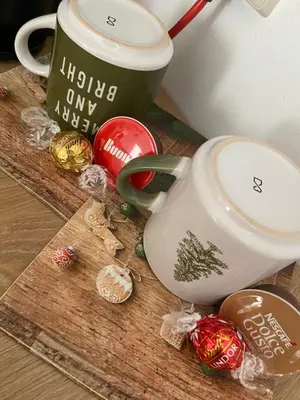 a table with a tea pot and christmas ornaments at Studio Chalet 13, St John Park Bansko in Bansko