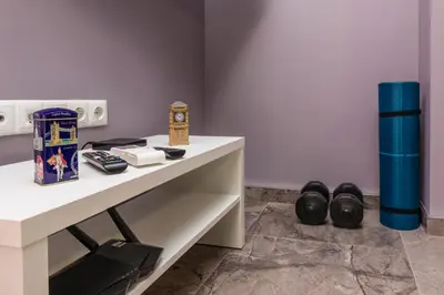 a room with a table with a clock on it at Stylish 1BD flat with a Parking Spot by Flat Mаnager in Plovdiv