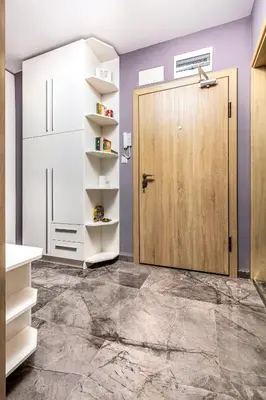 a bathroom with a wooden door and purple walls at Stylish 1BD flat with a Parking Spot by Flat Mаnager in Plovdiv