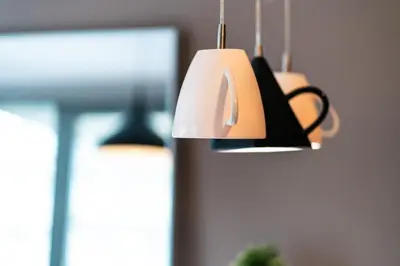 a couple of lights hanging in a room at Modern Apartment 2 with Parking next to Bulgaria Mall in Sofia