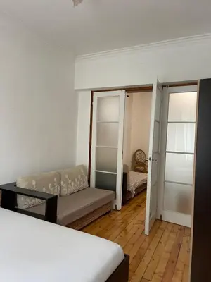 a room with a bed and a couch in it at Parchevich 26 Apartment - 24h Self Check-in in Sofia