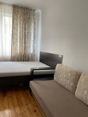 a room with two beds and a window at Parchevich 26 Apartment - 24h Self Check-in in Sofia