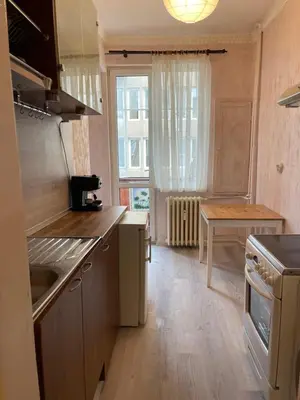 a kitchen with a sink and a stove top oven at Parchevich 26 Apartment - 24h Self Check-in in Sofia