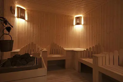 a sauna with two benches and a tub in it at Green Life, Bansko, private property in the complex Paradiso Verde, apartman C23 in Bansko