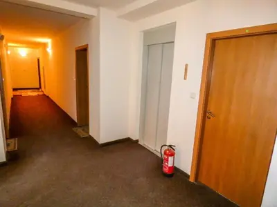 an empty hallway with a fire hydrant next to a door at Borovets Sequoia2 Apartment no 5 in Borovets