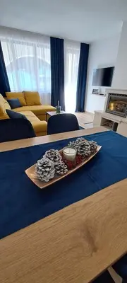 a table in a living room with a tray of food at Apartments KaVi , Monastery 1 & 3, Grand Monastery,Pamporovo in Pamporovo
