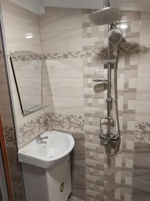 a bathroom with a sink and a shower at Тороманова къща in Koprivshtitsa