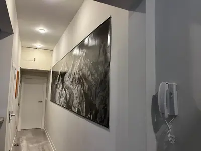 a hallway with a phone and a picture on the wall at Top Central Place with 2 bedrooms in Sofia in Sofia
