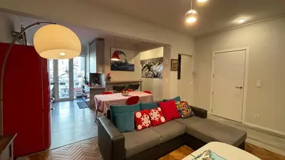 a living room with a couch and a table at Top Central Place with 2 bedrooms in Sofia in Sofia