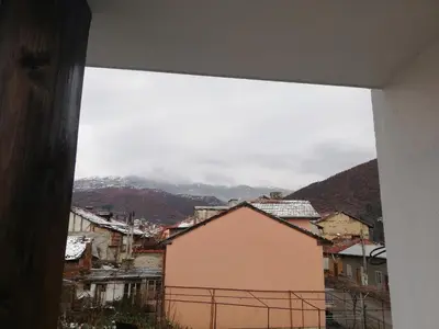 a view of a city from a window at Стаи за гости РИЛА in Rila