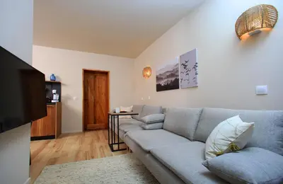 a living room with a couch and a table at KOKICHE 4 Friends, Borovets in Borovets
