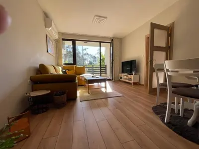 a living room with a couch and a table at Nikol 2 Deluxe in Velingrad