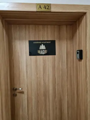 a door with a marvel sign on it at MAGRI Luxurious Apartment A42 Borovets Gardens in Borovets