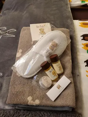 a towel with two bottles of essential oils and a bag at Pinewood ANG luxurious apartment A32 in Borovets