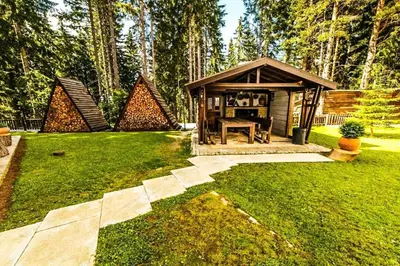 a gazebo in the yard of a house at Луксозен Апартамент Мечи Чал - Апартхотел Манастира 2 in Pamporovo