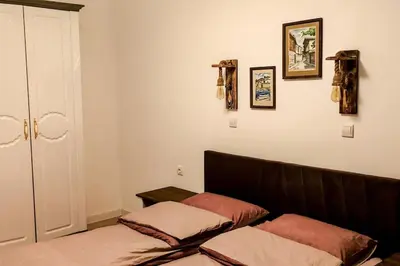 a room with two beds in a room at Луксозен Апартамент Мечи Чал - Апартхотел Манастира 2 in Pamporovo
