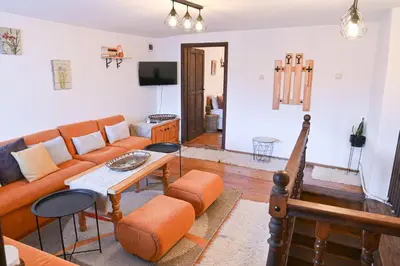 a living room with a couch and a table at 4 BDR House Monument of Culture & Architecture by Flat Mаnаger in Bansko