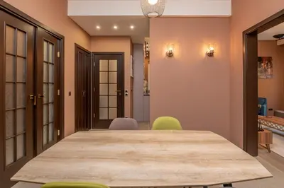 a dining room with a table and chairs at ~Angels ~ Two-Bedroom Deluxe Flat in City Centre in Sofia