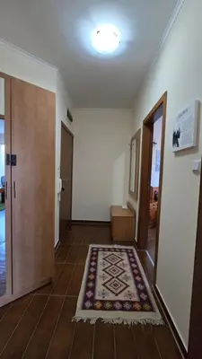 an empty hallway with a rug on the floor at Bansko Boutique Apartments - Flora Boutique in Bansko