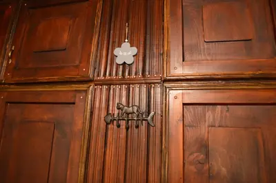 a wooden door with a dog sign on it at Yakusha - Якуша, къща за гости in Shiroka Lŭka