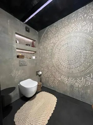 a bathroom with a toilet and a wall with a mandala at Bashtin Dom - Skabrin House in Bansko