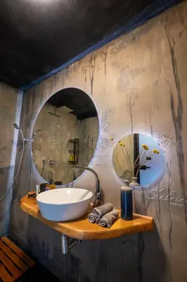 a bathroom with a sink and a mirror at Bashtin Dom - Skabrin House in Bansko