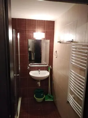 a bathroom with a sink and a mirror at Bansko Royal Towers - Studio 815 in Bansko