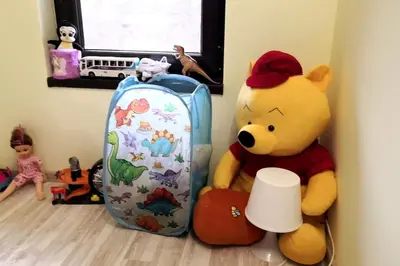 a stuffed teddy bear sitting next to a backpack at Еко вила Дивна - Тетевенски балкан in Divchovoto