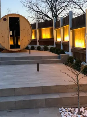 a building with stairs and a building with lights at Семеен хотел и ресторант Райски залив in Golyama Zhelyazna