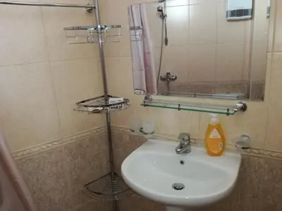 a bathroom with a sink and a mirror at Гранд Манастира Пампорово, Двустаен апартамент Deluxe in Pamporovo
