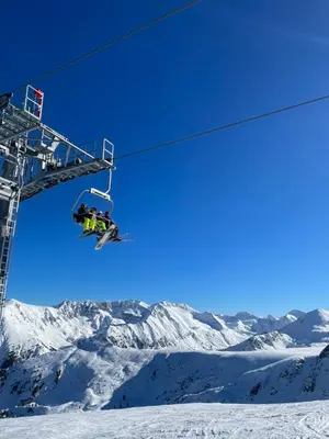 a group of people on a ski lift at Ground floor 2-bedrooms, 2-bathrooms apartment near Bansko in a complex with pools and SPA included in Razlog