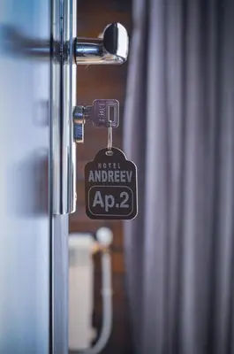a door with a key tag on it with a curtain at Family hotel Andreev in Dobrinishte