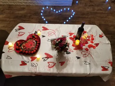 a table with a heart and flowers and candles on it at Forest Home 524 in Smolyan