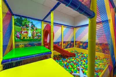 a childs play room with a slide and balls at Forest Home 524 in Smolyan