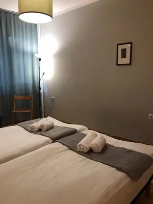 a bedroom with two beds with towels on them at EU metro station, City Center, lovely 3-bedroom apartment, free parking in Sofia