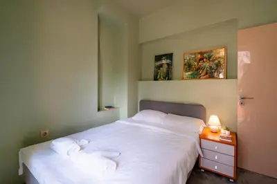 a bedroom with two beds and a table with a lamp at Elegant 2bdr Apartment with a Balcony in Sofia