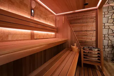 a sauna with a wooden floor and a staircase at Mountain View in Govedartsi