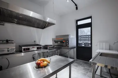 a kitchen with a bowl of fruit on a table at Mountain View in Govedartsi