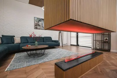 a living room with a couch and a fish tank at Mountain View in Govedartsi