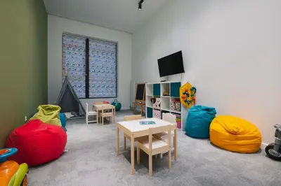 a room with brightly colored chairs and a table at Mountain View in Govedartsi