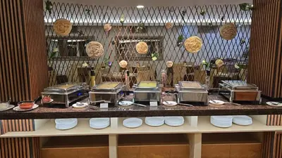a counter with several toasters and plates on it at Kamena Pamporovo in Pamporovo