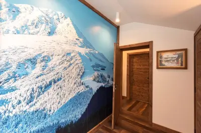a bedroom with a mural of a snow covered mountain at Finest Luxury Penthouse Bansko Royal Towers in Bansko