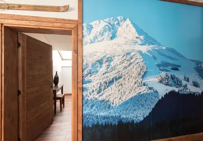 a mural of a snow covered mountain on a wall at Finest Luxury Penthouse Bansko Royal Towers in Bansko