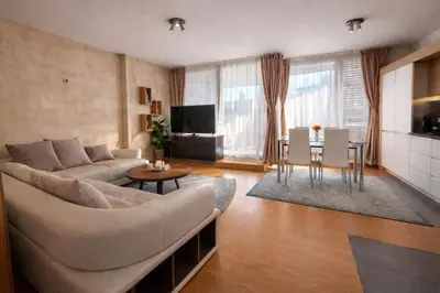 a living room with a couch and a table at Silver city Paradise in Sofia
