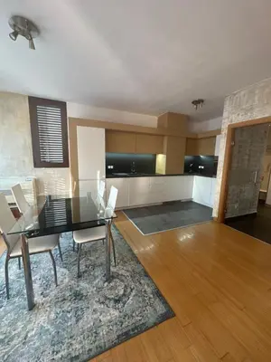 a dining room with a glass table and chairs at Silver city Paradise in Sofia