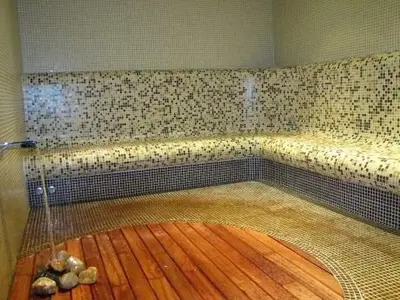 a shower in a room with a wooden floor at Silver city Paradise in Sofia
