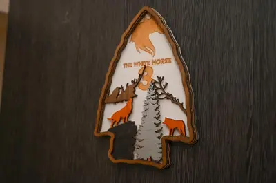 a cookie with a tree and animals on it at The White Horse Apartments in Borovets