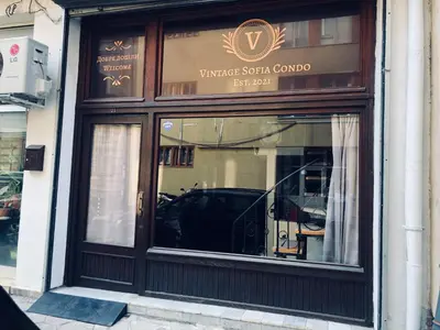 a window of a wine store with a car in it at Top Center Vintage Sofia Condo in Sofia